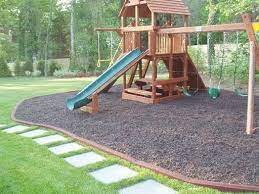 Create A Safe Play Area With Rubber Borders And Long Lasting Rubber Mulch 12yrcolorguarantee Pla Playground Mulch Playground Landscaping Backyard Playground