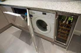 As long as you already have the necessary plumbing ready, installing a washing machine only requires you to make the right drain and supply connections, level the washer and plug it in. How To Integrate A Washing Machine Into A Kitchen