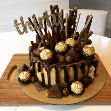Squeeze the bottle over the rim of the cake to get varying length drips. 30th Birthday Chocolate Drip Cake With Caramel And Chocolate Explosion Cake Recipes Baking Life Delicious Desserts
