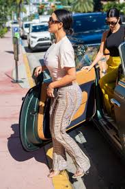 Kim Kardashian Wore 4 Snakeskin Prints In One Outfit Insider The two reality stars both wore slinky black gowns by tom ford for gucci, because twin dressing is back.