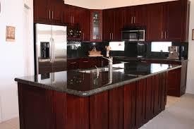 Cherry kitchen cabinets combined with brazilian cherry wood flooring, a black granite countertop and a black glass chandelier complete this transitional cherry kitchen cabinets capitalize on all of these advantages. Kitchen Design Ideas Stone International Shaker Cabinets
