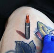 Bite The Bullet Tattoo 60 Bullet Tattoos For Men A Shot Of Design Ideas Bullet Tattoo Tattoos For Guys Tattoos