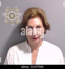 Fulton County jail booking mugshot for Harrison Floyd, the former director  of Black Voices for Trump, at the time of his processing. Floyd is charged  with violation of Georgia's RICO Act, conspiracy