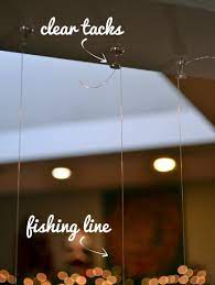 A textured ceiling can refer to a variety of ceiling designs, from outdated popcorn ceilings to ornately carved wood ceilings to plaster ceilings with designs created on top of them with a trowel. How To Hang Floating Christmas Ornaments The Diy Playbook Christmas Hanging Decorations Christmas Window Decorations Floating Ornaments