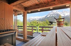 Studio like living room with double bed, kitchenette, dinette, cable tv, couch, shower/toilet, balcony facing towards the wilder kaiser and the golf course, carport Hochfilzer Panorama Sauna