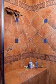 A Shower With Waterfall Heads I Like The Built In Seat But I Would Want Another Pair Of Waterf Waterfall Shower Mexican Tile Bathroom Spanish Style Bathrooms