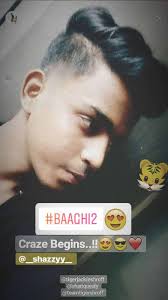 Tiger Shroff S New Look Is A Rage Amongst Fans Now, tiger shared a video from the the director ahmed khan was there by his side as he got his hair cut. rage amongst fans