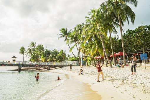 Couple Take Photos On Siloso Beach At Sentosa Island Resort Stock ...