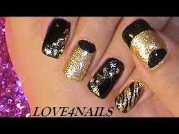 Sabiendo como combinarlo con otros colores decoración de uñas negras: Decoracion De Unas Rockstar Oro Y Negro Youtube