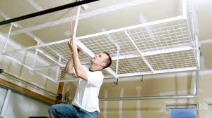 Installing overhead garage storage is a great way to gain storage space while sacrificing zero floor space. How To Install A Overhead Garage Storage Rack Ceiling Mount Shelf Youtube