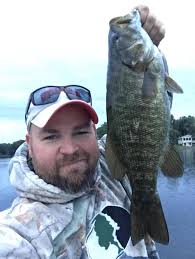 Smallmouth bass eats a small snake
