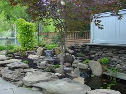 How much does a koi pond cost? Ny How Much Does It Cost To Install A Koi Pond Rochester New York Acorn Ponds Waterfalls