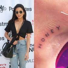 The tiny tattoo is made up of the roman numerals for one, four, and three—which typically stands for i love you. Shay Mitchell S 4 Tattoos Meanings Steal Her Style