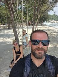 Lady in the white top sat down just as I was getting my shot. Worse still,  ordered me and my wife to move so we wouldn't ruin HER shot...AI seems  unable to