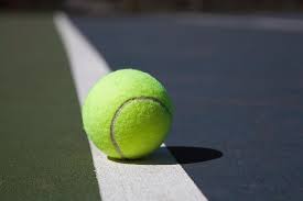 Tennis Ball On A Line In A Court by Snap Decision