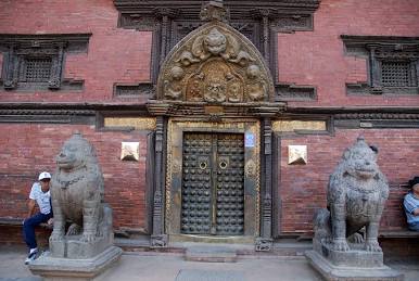 Stone royal guardian lions flanking a palace doorway in Patan, AI generated