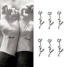 Furthermore, if you're getting a tattoo for the first time, you may want to consider getting a tiny tattoo design somewhere that can be hidden. Amazon Com Oottati Small Cute Temporary Tattoo Wrist Handwriting Love Set Of 2 Beauty Personal Care