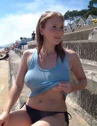 Showing her boobs in a transparent wet tshirt