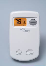 It's clear protective plastic with a solid base and can be locked with the key. White Rodgers Non Programmable Thermostat 1e78 144
