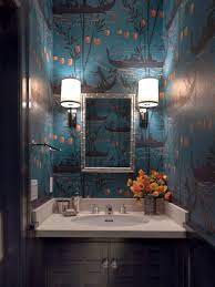 A small powder room with curved/bowfront vanity with custom granite countertop and undermount sink. Unique Powder Rooms To Inspire Your Next Remodeling