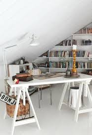 A tiny home office under the stairs dark, almost black, wood floor looks amazing with white walls of this under the staircase office. Loft Attic Office Novocom Top