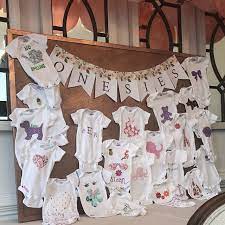 Onesies Decorating Station Iron On Appliques Baby Shower Etsy Baby Shower Crafts Baby Shower Activities Baby Shower Onesie