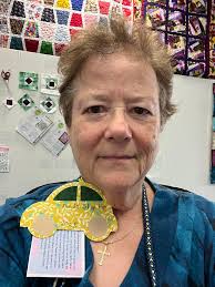 Tropical vibe quilt with scrappy batik binding