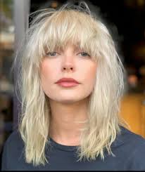 Buttery Ash Blonde with that Debbie Harry Blondie textured fringe and  Haircut. Creates lots of movement and stunning tones within the hair. Sure  to be a great look for summer 2020. Good