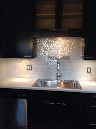 Find ideas and inspiration for spanish tile chandeliers over the island and sink add sparkle with the focal point at the range with a venetian. Mixed Cloud White Glimmer Glass Tile Kitchen Remodel Kitchen Design Kitchen Inspirations