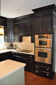 Paint a matte black accent wall. One Color Fits Most Black Kitchen Cabinets Kitchen Design Small Home Kitchens Kitchen Soffit