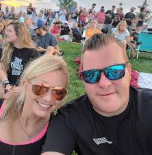 Who is the other photographer taking photos at the riders meeting?