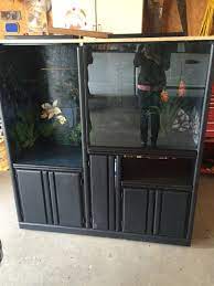 This bearded dragon tank is awesome because it provides tons of different natural textures for the bearded dragon to enjoy. Repurposed Entertainment Center For Slimy Critter Fanatics Hometalk