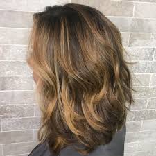 Undone waves work well with rich, polished shades of brown and face framing layers. 49 Stunning Brown Hair With Highlights For 2021