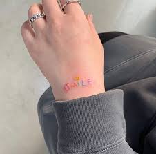 It is a very meaningful and obvious choice to have a matching small tattoo with your loved ones. Best Smile Tattoo Design On Hand With Latest Small Tattoo On Hand Ideas Small Hand Tattoos Tiny Tattoos Graffiti Tattoo