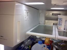 This probably happened when a few ice cubes got 'bumped' up from the ice bin and onto the area around/below the ice maker itself. Electrolux Frigidaire Fpbc2277rf5 Icing Behind Ice Maker Doityourself Com Community Forums