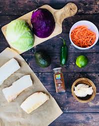 Squeeze a lime wedge over each fish taco, then top with the sliced avocado and coleslaw. Spicy Cod Fish Tacos With Jalapeno Lime Slaw Super Safeway