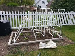 Raised beds planted with tomatoes, okra, peppers and various herbs. Help With Trellis Gardening Forums