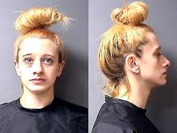 Woman charged in heroin death