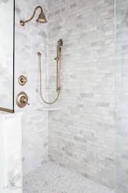Shower Tile Combination Marble Subway Tile On Walls And Marble Penny Tile On The Floor Farmhouse Shower Bathroom Tile Designs Patterned Bathroom Tiles