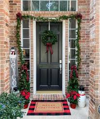 Decorating your front door is a relatively easy way to add some holiday cheer to your home. Christmas Door Decorations To Try This Year