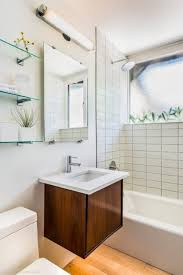 White brick tile walls contrast to black tone on another part of the wall. Mid Century Modern By Kimberly Demmy Design Homeadore Mid Century Modern Bathroom Modern Bathroom Layouts Mid Century Bathroom