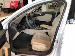 Ibis White With Tan Interior On The 2018 Audi A4 Front Row Seat And Steering Wheel View Vehicle Located At Audi Of Bridgewater Audi Dealership Audi Vehicles