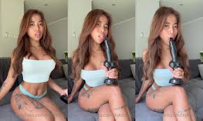 Lily Brown Sucks A Black Rubber Cock