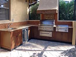 Rustic white kitchen with log storage. Outdoor Kitchen Trends Diy