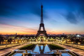 The giant miracle structure of eiffel tower is made out of wrought iron from the bottom to the top which touches the sky, today it is one of the most iconic structures in the world and also the identity of. Hd Wallpaper Eiffel Tower Paris Road Sunset The City Lights France The Evening Wallpaper Flare