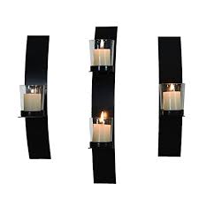 These sconces typically feature a glass container that houses a candle, with easy access to the candle for lighting, extinguishing and replacement. Elegan Set Of 3 Metal Wall Sconces With Glass Candle Holder 2 Small Amp 1 Large Buy Online In Grenada At Grenada Desertcart Com Productid 42152645