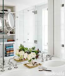 A deep floating sink includes a hand towel rack and long curved stainless steel faucet. Chevron Bathroom Tile Chevron Floor