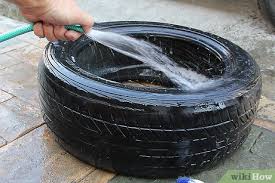 Center the tire on the bottom support, then use adhesive to secure the other piece of plywood to the top of the tire. How To Make A Living Room Table From An Old Tire 8 Steps