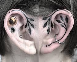 Spider web tattoo behind ear. 10 Of The Least Painful Places To Get Tattooed Tattoo Com