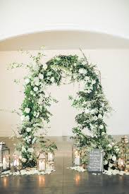 Ceremony Arch With Branches And White Flowers Surrounded By Lanterns Candles And Pet Vintage Wedding Arches Wedding Ceremony Decorations Wedding Arch Flowers